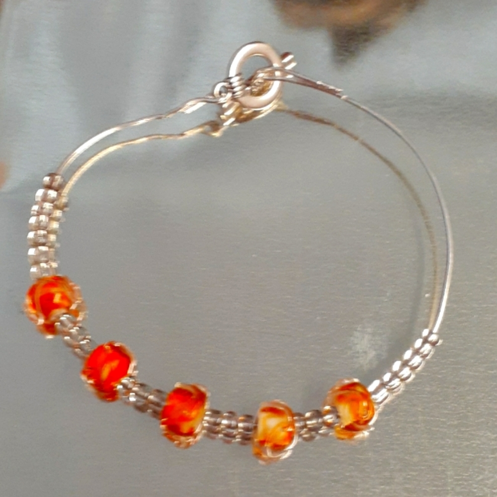 Orange beaded bracelet.
